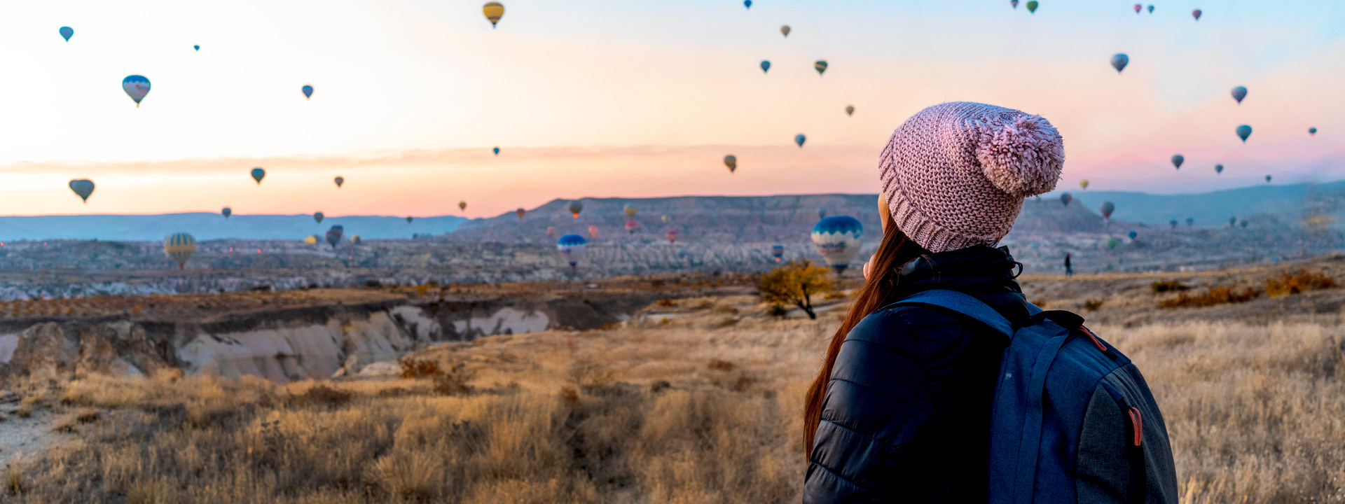 hiker looking at hot air ballons, Turkey, solo female traveler