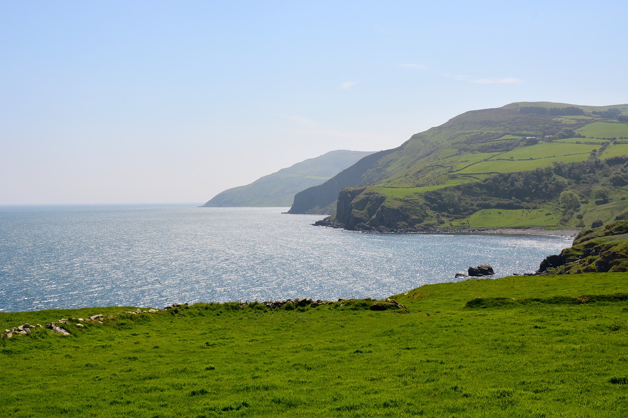 famous landmarks in Ireland, cliffs in Ireland, sea with rolling green hills, Ireland