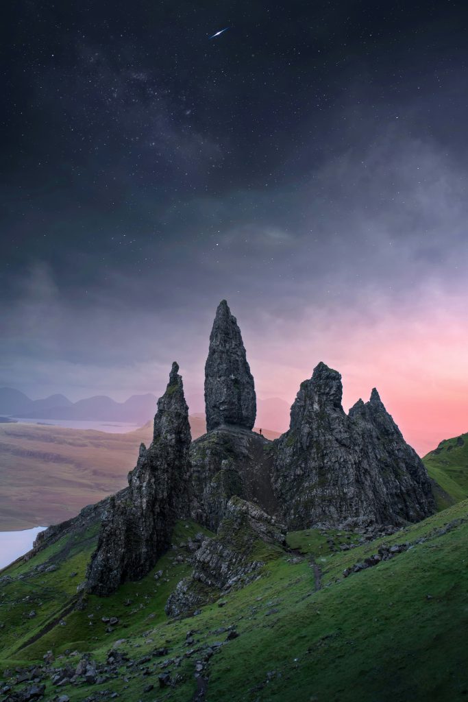 2 day Isle of Skye Itinerary. This is an image of the Old Man of Storr against a backdrop of the Milky Way.