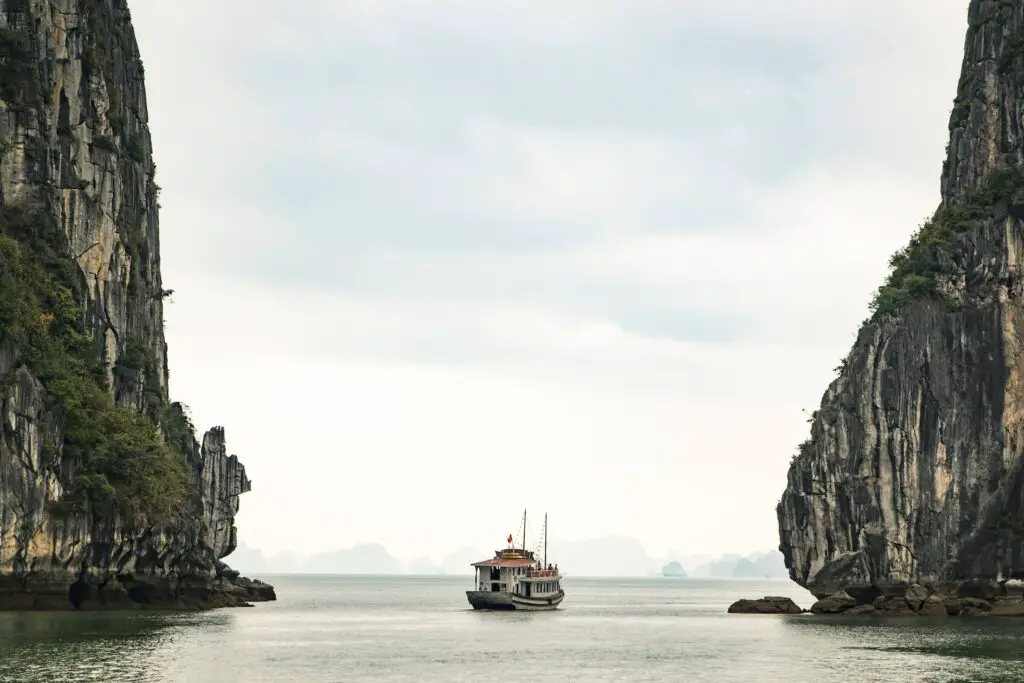 1 day in Hanoi, Halong Bay, boat sailing through two limestone cliffs